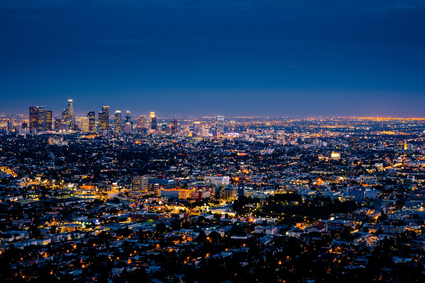 City skyline at dusk with layered silhouettes